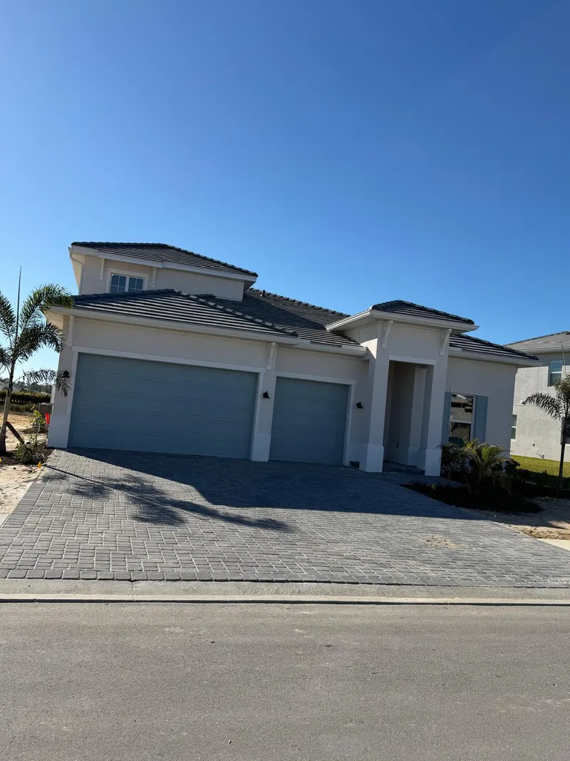 Finished modern home with three-car garage built by Family Service Construction
